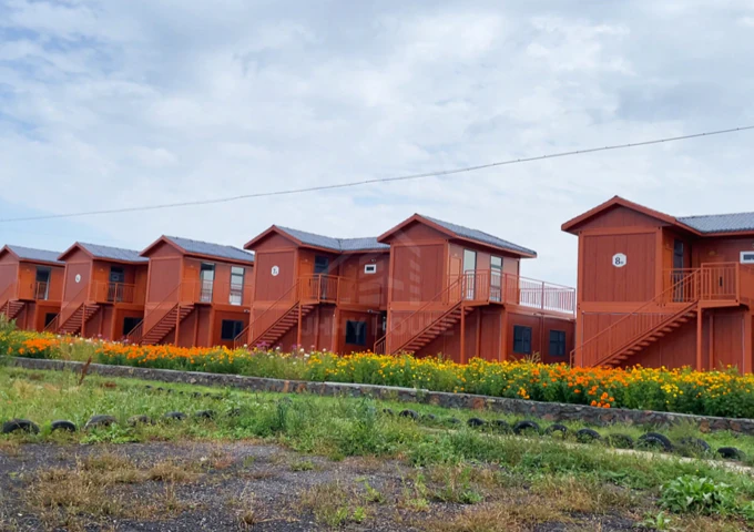 What a beautiful container home community, nestled beside stunning grassland scenery!